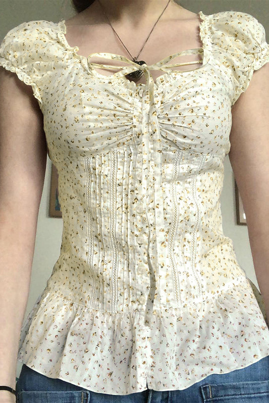 Vintage-Bluse mit Blumenmuster, Bindeknöpfen und Puffärmeln