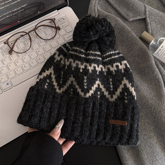 Grobe Häkelbommelmütze