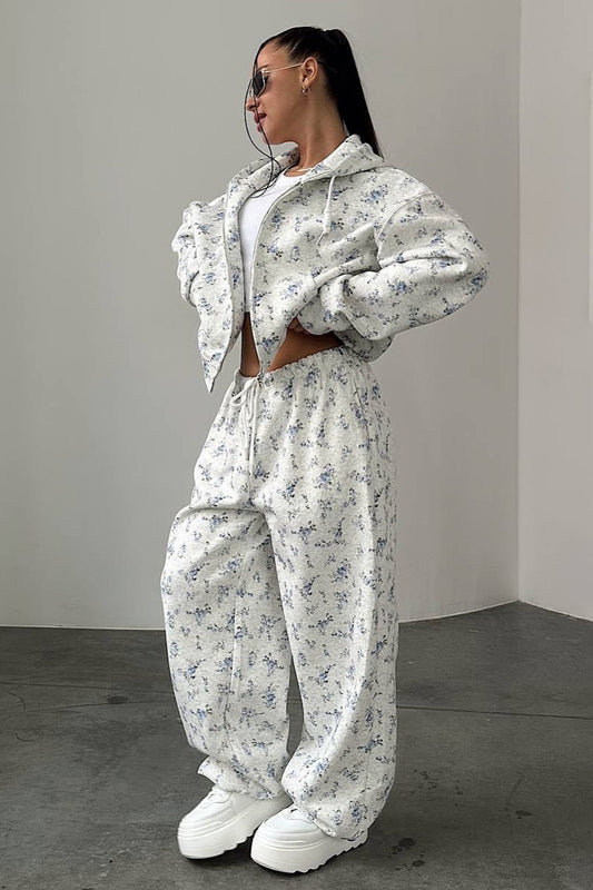 Zweiteiliges Set mit kurzem Kapuzenpullover mit Reißverschluss und Kordelzug und weitem Bein