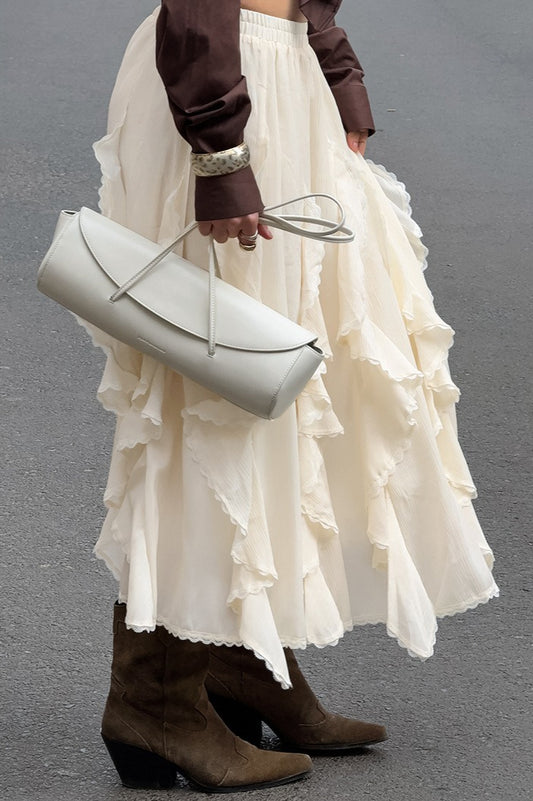 Aprikosenfarbener Rüschenrock mit elegantem Spitzenbesatz