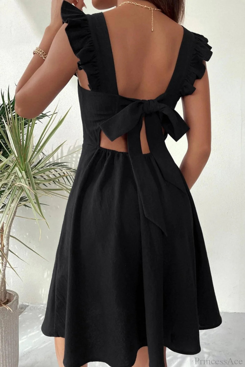 Sleeveless Mini Dress With Ruffle Detail And Tie-Back Black / M Dresses