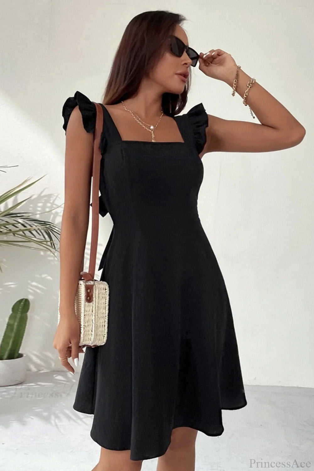 Sleeveless Mini Dress With Ruffle Detail And Tie-Back Black / Xs Dresses